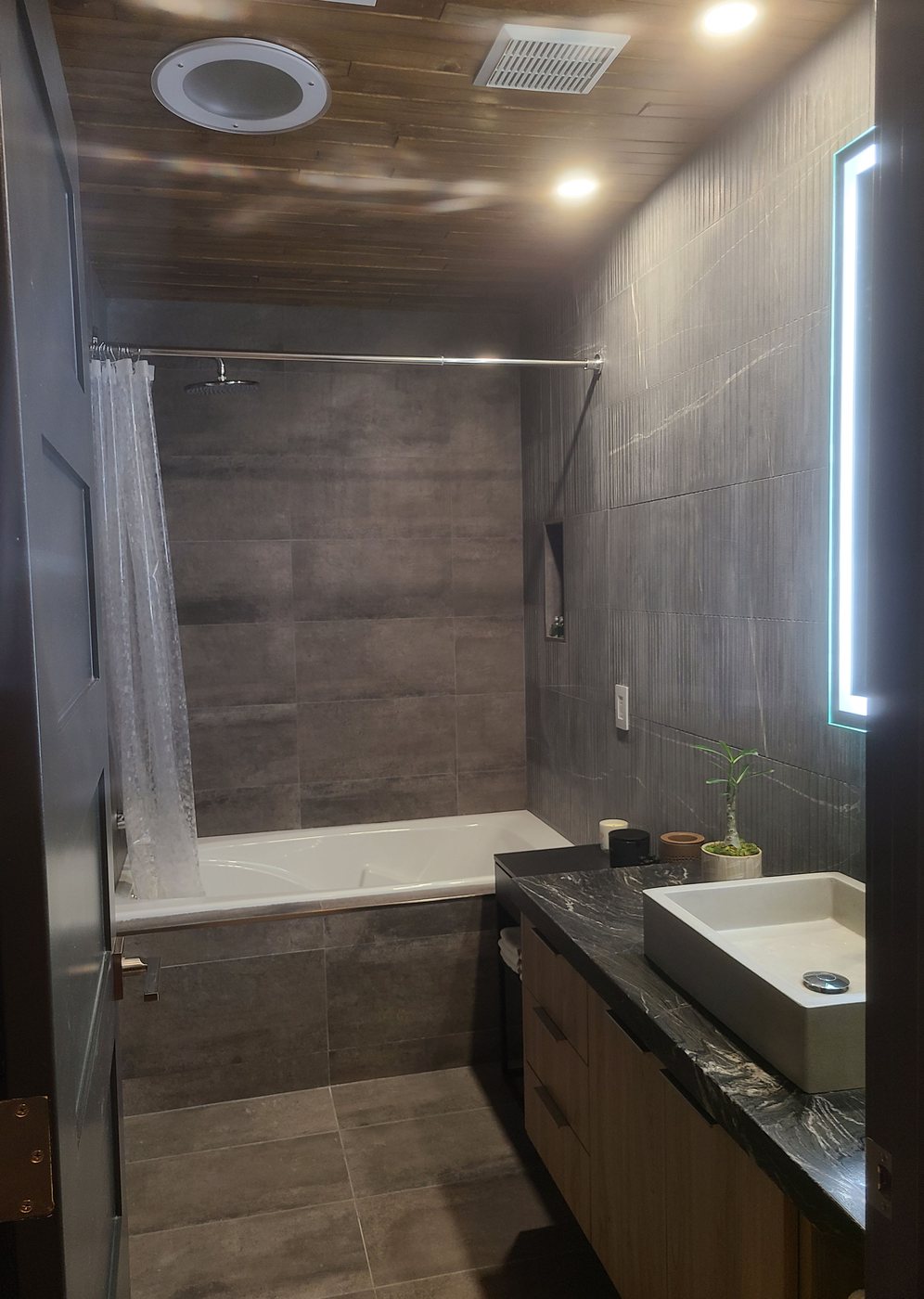 Zen bathroom with jetted soaker tub.
